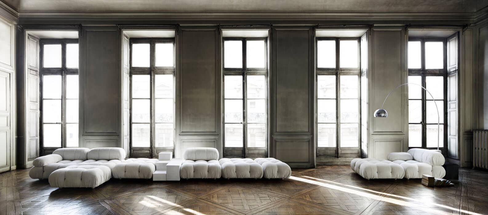 White Camaleonda seating arranged across a grand Paris room
