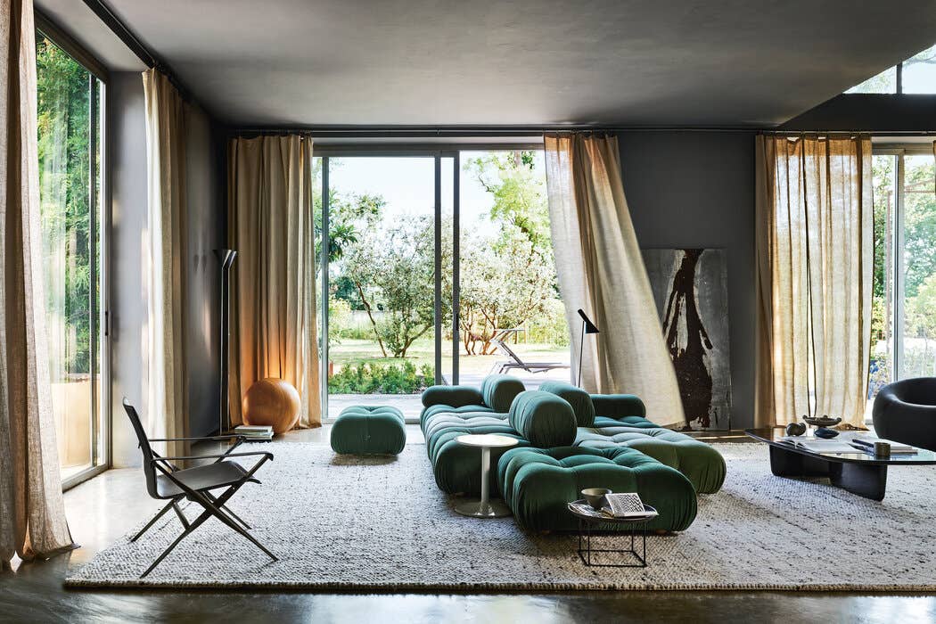 Green Camaleonda modular sofa in a light-filled contemporary interior