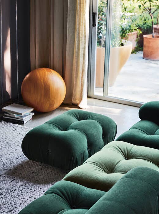 Close view of green Camaleonda seats and ottoman