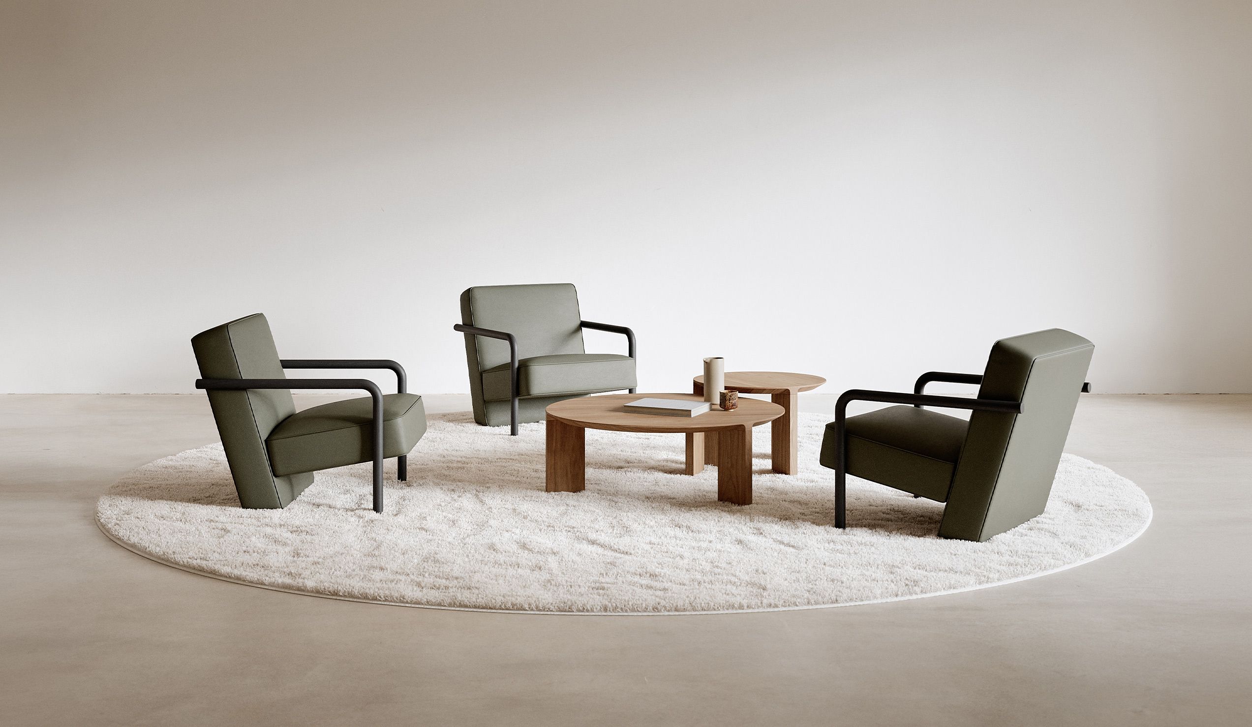 Four Parker lounge chairs arranged around a low table