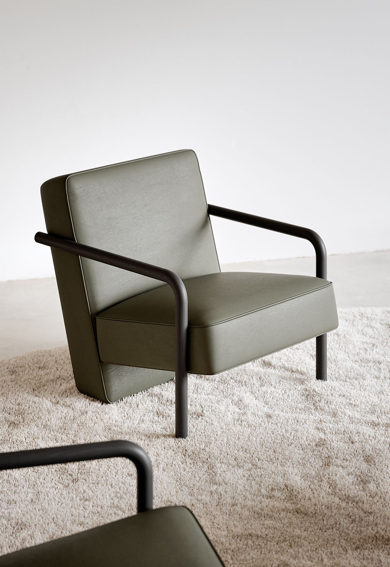 Green upholstered Parker chair in a room